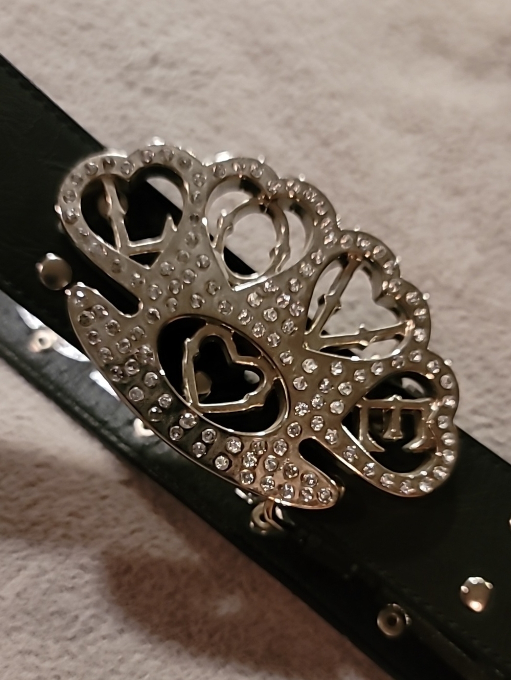 Black Decorative Studded Belt with Silver Buckle Shaped Like Brass Knuckles.